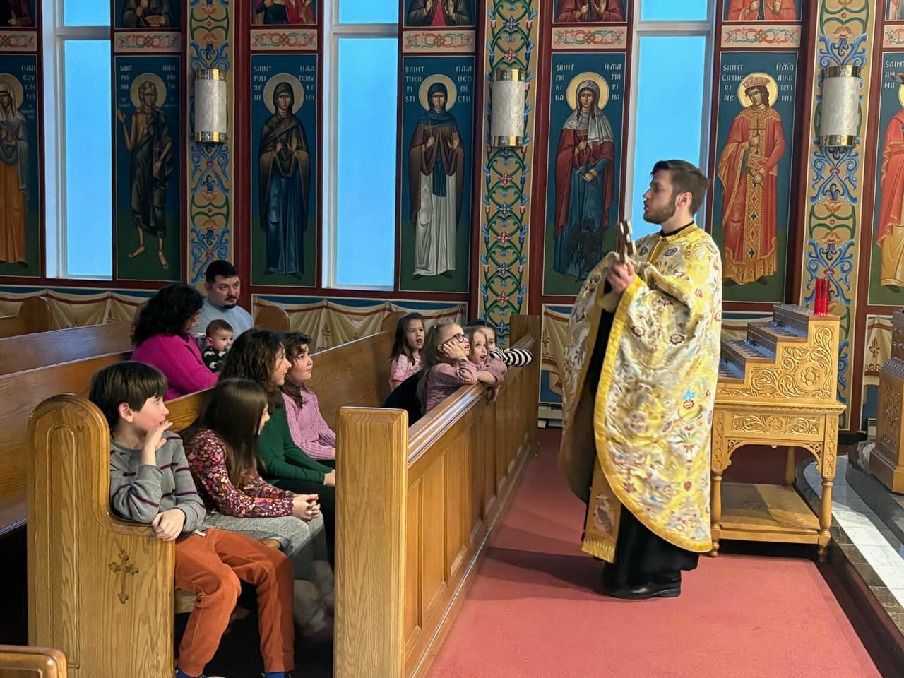 Father Theodore ministering to the kids of our parish